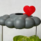 Red heart charm for dripping rain cloud with stormy cloud