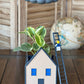 Stormy dripping rain cloud by THE CLOUD MAKERS with ladder charm in cozy house planter